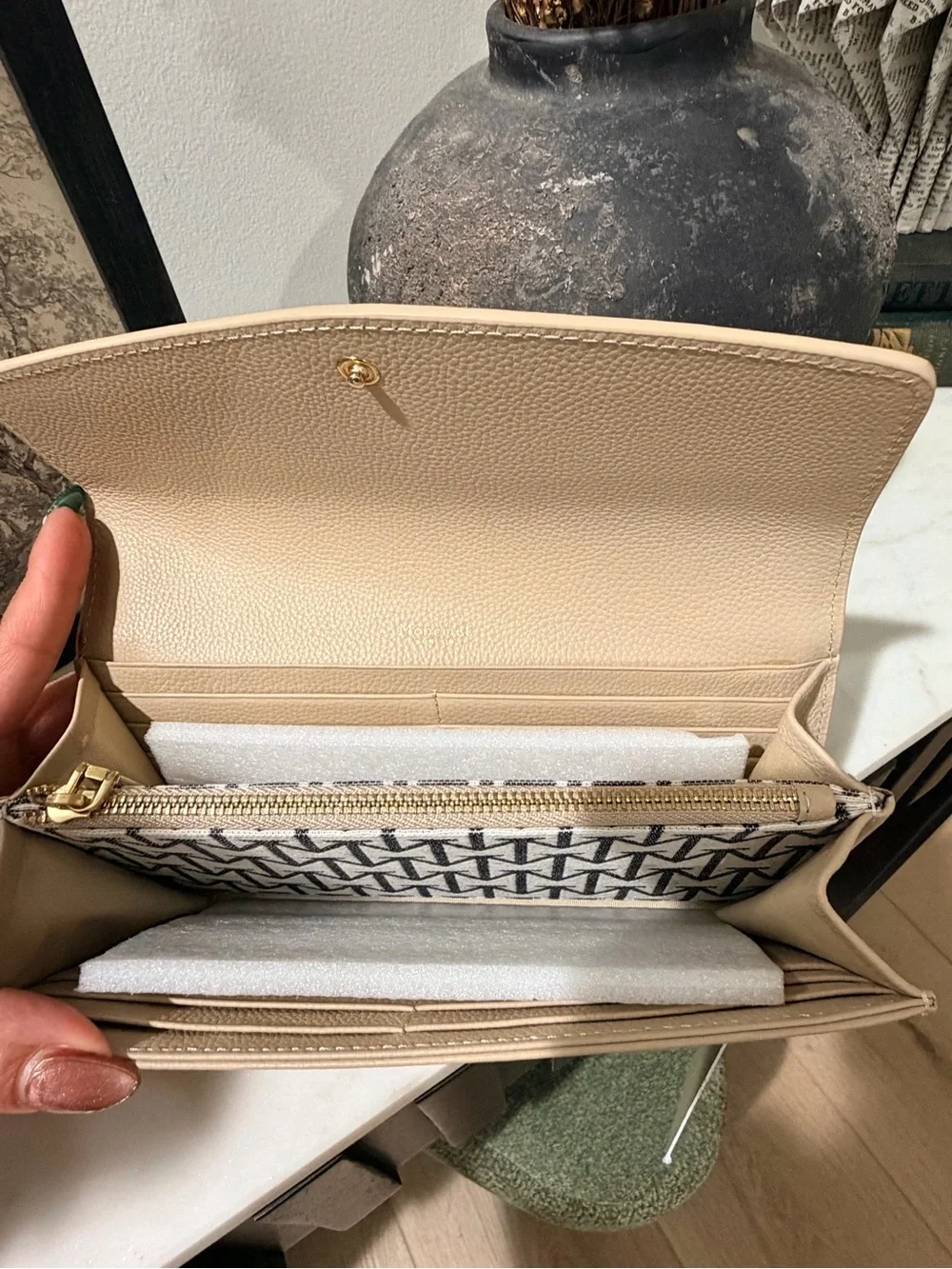 Moncrieff Beige Pebbled Leather Clutch